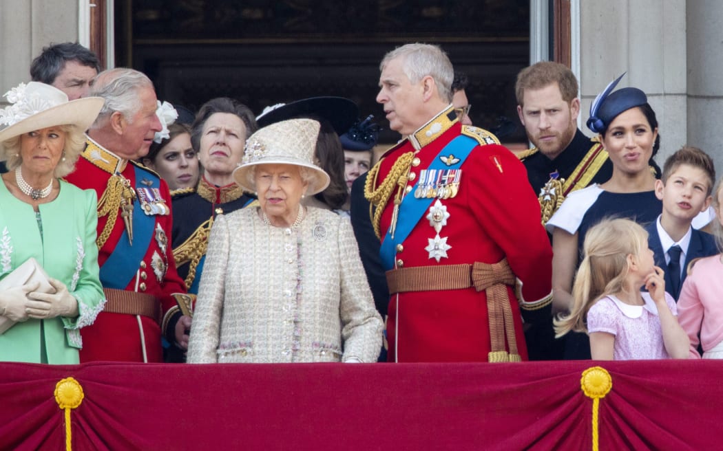Queen Elizabeth II, Prince Charles, Camilla, Duchess of Cornwall, Princess Anne, Prince Andrew, Prince Harry and Meghan, Duchess of Sussex at the balcony of Buckingham Palace in June.