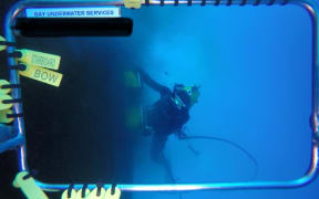 Bay Underwater Services divers cleaning a ship’s hull.