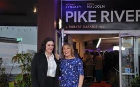 Melanie Lynskey and Robyn Malcolm outside Greymouth's Regent Theatre for the Pike River film premiere.
