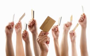 Credit cards held in the air