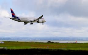 Latam plane landing in Auckland Airport.