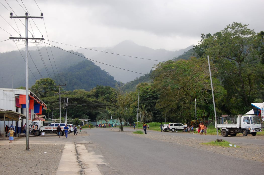 People at Alotau town street, hills view, Papua New Guinea, 2011.