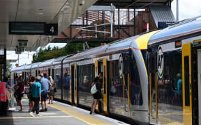 An electric train pulls into Pukekohe Station.