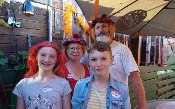 Micah Ruth and Glyn Harrison supporting the only redhead in the family -Jesse.