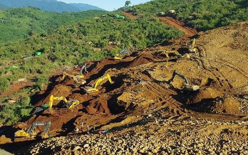 The scene of the massive landslide that has claimed dozens of lives.