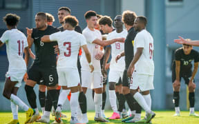 Players of both teams (L-R: Bill Tuiloma, Michael Boxall and Joe Bell of New Zealand) start an argument during the New Zealand All Whites v Qatar, men’s international friendly football match at Sonnenseestadion, Ritzing, Austria on Monday 19 June 2023.