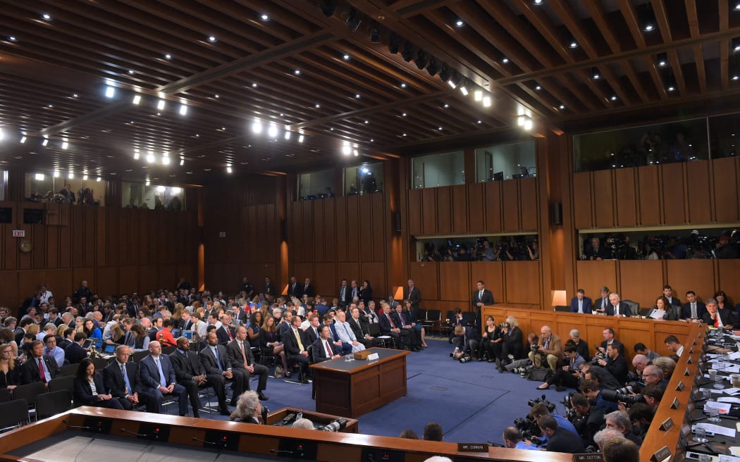Fired FBI director James Comey testifying on the stand in a crucial US Senate Select Committee hearing in 2017, where he repeated allegations that then-President Donald Trump badgered him over a highly sensitive investigation into Russia's meddling in the 2016 US election.