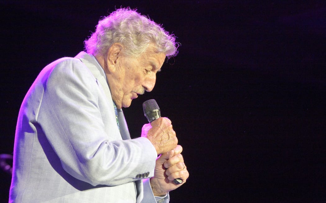 (FILES) US singer Tony Bennett performs during an invitation only concert at the newly opened Encore Boston Harbor Casino in Everett, Massachusetts, on August 8, 2019. Bennett, the last in a generation of classic American crooners whose ceaselessly cheery spirit bridged generations to make him a hitmaker across seven decades died on July 21, 2023, in New York, US media reported. He was 96. (Photo by Joseph Prezioso / AFP)