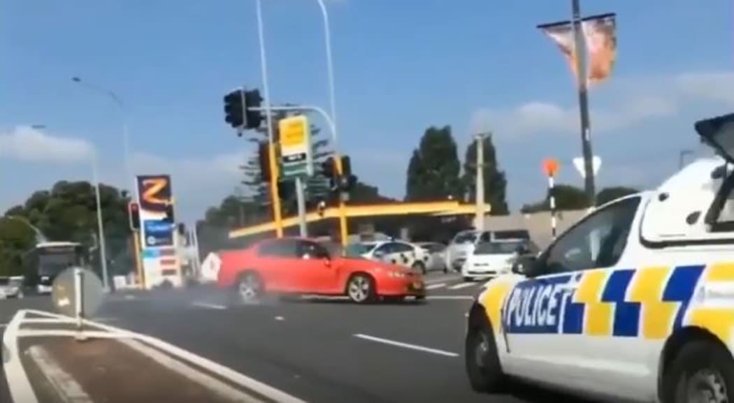 A red Holden sped across Auckland on 31 January as police chased after the car.