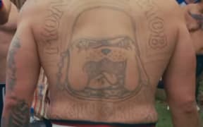 One of the 32 fighters involved in a controversial and unregulated backyard fight contest at the weekend has been referred to the police.
The man, whom Checkpoint understands to be a senior Mongrel Mob member from the Bay of Plenty, was wearing an electronic monitoring bracelet in footage of his fight released to social media and was supposed to be attending a rehabilitation programme.