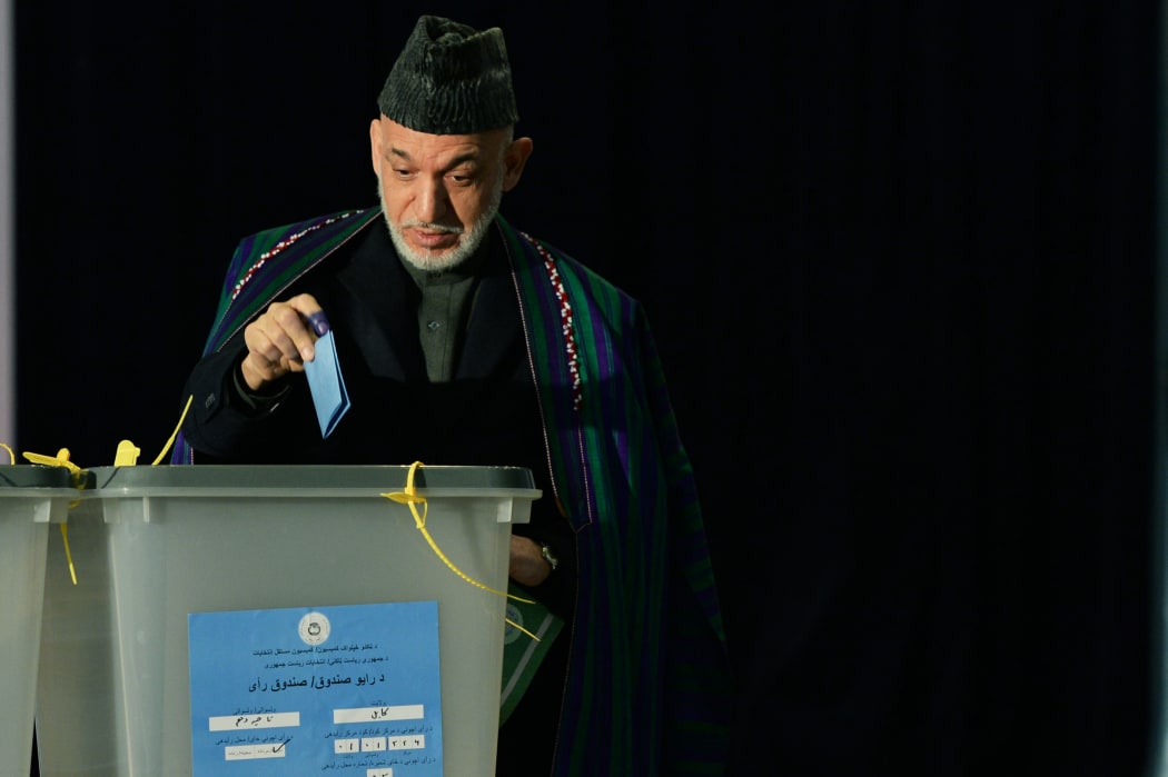 Hamid Karzai casts his vote at a Kabul polling station.
