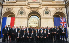 New Zealand's national rugby union team All Blacks players pose for a group photo during a welcoming ceremony at the town hall with mayor Gregory Doucet in Lyon, central-eastern France, on September 1, 2023, ahead of the Rugby World Cup 2023 France. (Photo by OLIVIER CHASSIGNOLE / AFP)