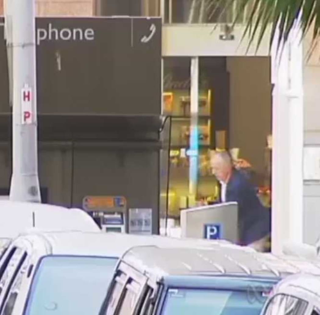 John O'Brien caught on camera as he escapes from the Lindt cafe.