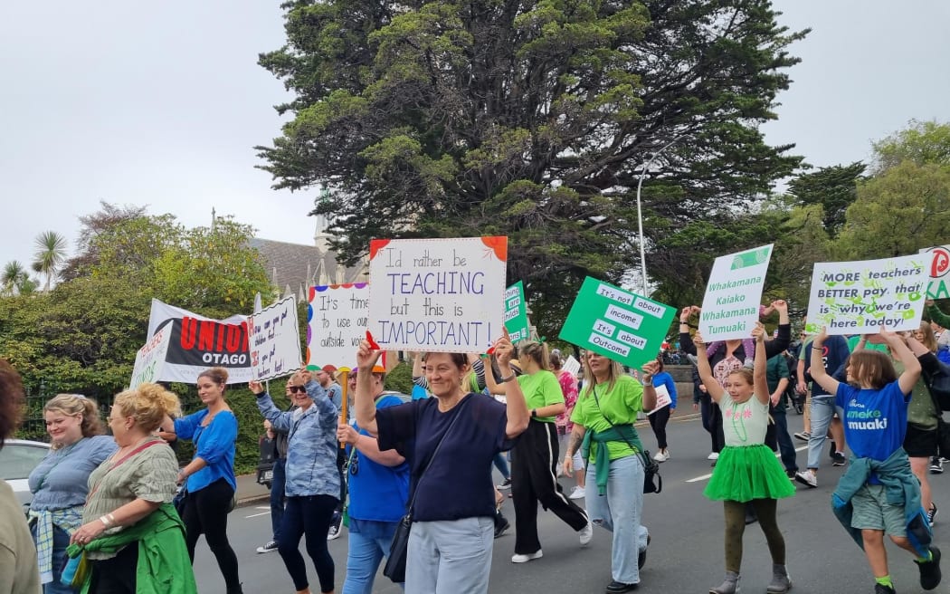 Teachers striking over pay and conditions march in Dunedin, 16 March 2023.