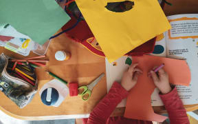 A child works on a project in the classroom.