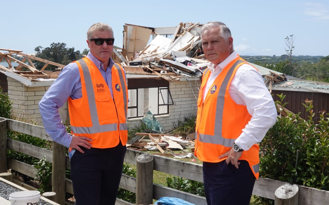 Northland MP Grant McCallum and Emergency Management Minister Mark Mitchell outside the Mangawhai home where a woman was seriously injured by a tornado.