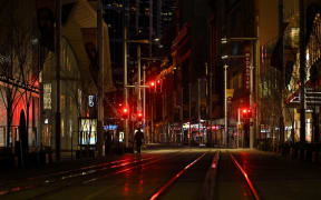 A quiet George Street promenade is pictured on a usually busy evening in Sydney on July 17, 2021, after authorities ordered new restrictions as a weeks-long lockdown failed to quash an outbreak of the Covid-19 coronavirus.