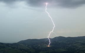 Lighting hitting a fence in farmland, near Novalaise, Savoie in France, on 22 July, 2017.