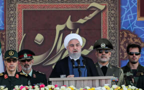 Iranian President Hassan Rouhani  giving a speech during the annual "Sacred Defence Week" military parade today.
