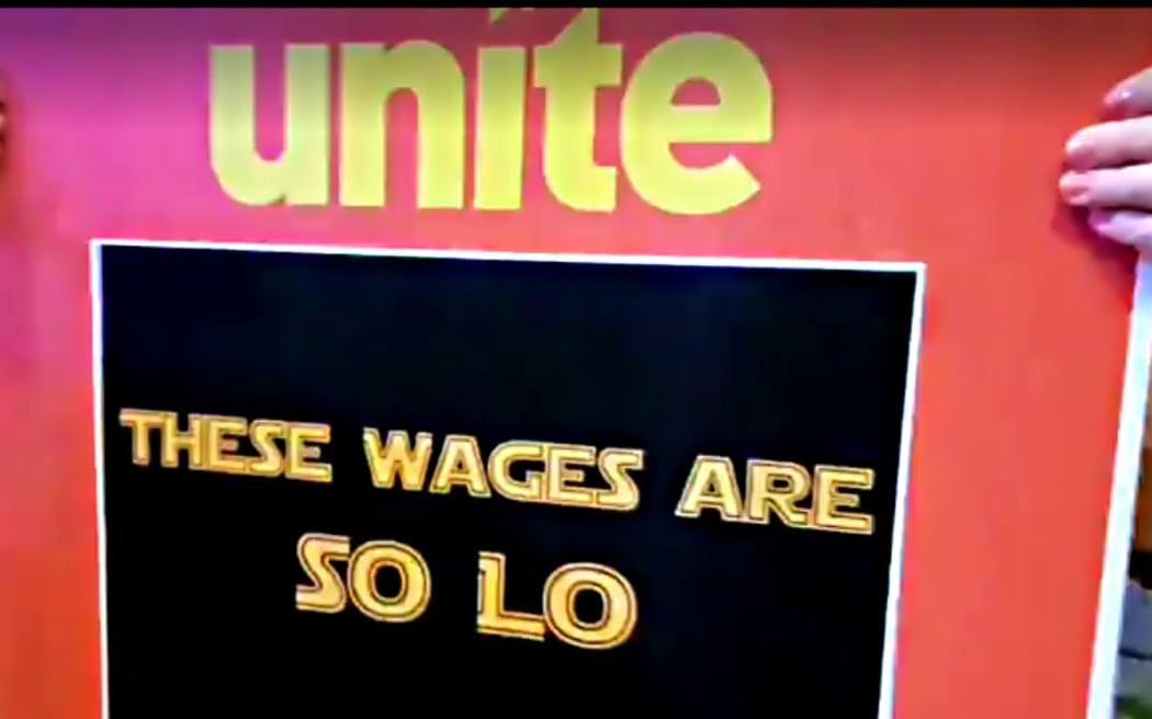 Cinema staff and members of Unite union strike outside the premiere of the new Star Wars film.