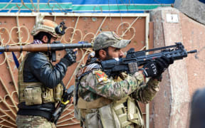 Iraqi forces take aim in Mosul in ongoing efforts to re-take the city from Islamic State.