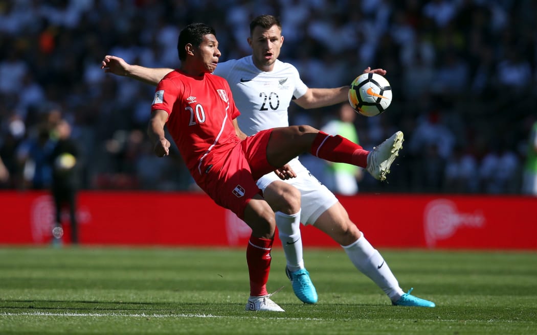 New Zealand's Tommy Smith up against Peru's Edison Flores.