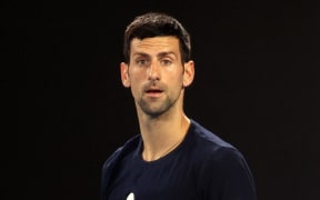 Novak Djokovic of Serbia attends a practice session ahead of the Australian Open tennis tournament in Melbourne on January 14, 2022. (Photo by MARTIN KEEP / AFP) /