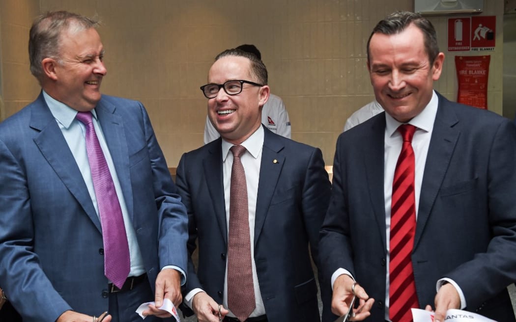 File photo of Qantas chief executive Alan Joyce (C), Western Australian Premier Mark McGowan (R) and Anthony Albanese opening a new transit lounge at Perth Airport on March 24, 2018.