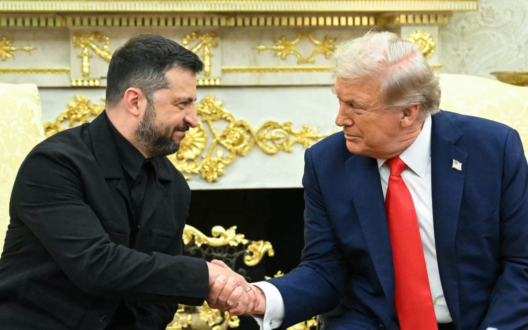 Ukrainian President Volodymyr Zelensky and US President Donald Trump shake hands during a meeting in the Oval Office of the White House in Washington, DC, on August 18, 2025. European leaders join Ukrainian President Volodymyr Zelensky in talks with US President Donald Trump on August 18, as they try to find a way to end Russia's offensive. The leaders heading to Washington on Monday to appear alongside Zelensky call themselves the "coalition of the willing." (Photo by Mandel NGAN / AFP)