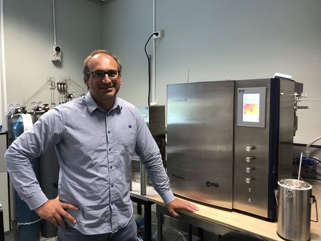 Dr. Franck Natali beside the ammonia reactor.