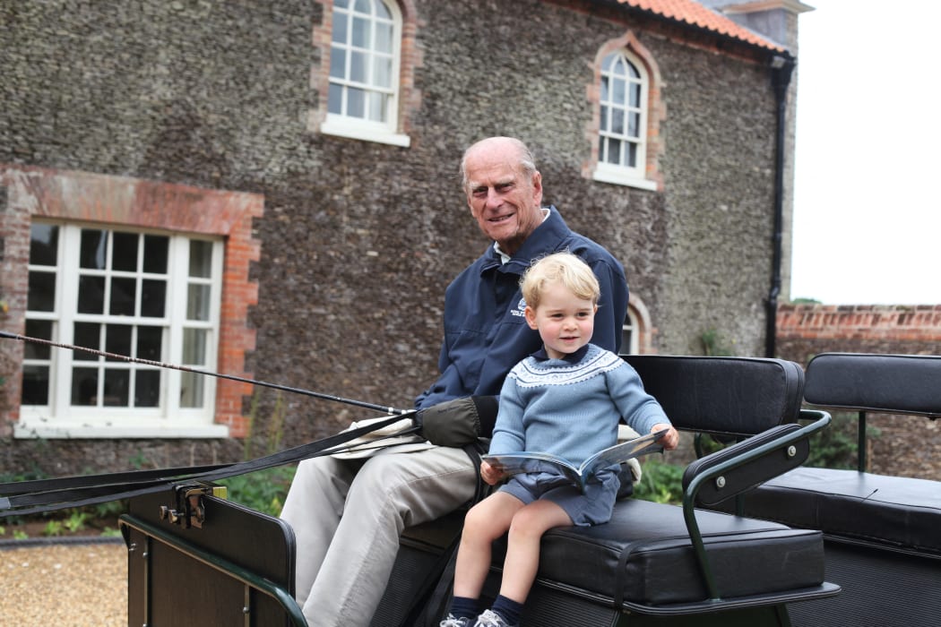 Kensington Palace shared a photograph of Prince George with his great-grandfather Philip, taken by the Duchess of Cambridge, alongside the message from William.