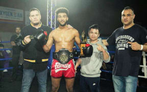 Vahid Unesi (R), coach Yordniyom Yuttakangumtorn, kickboxer Hayollem Tesfay (middle) and Richie of Kings Academy