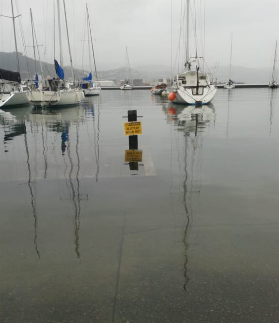 A king tide floods boardwalk in Wellington's Clyde Quay marina.