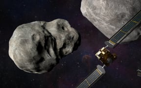 An illustration of NASA’s DART spacecraft and the Italian Space Agency’s (ASI) LICIACube prior to impact at the Didymos binary system.