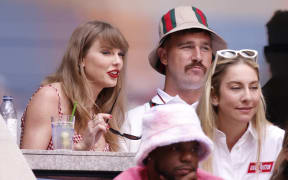 US singer-songwriter Taylor Swift (L) and boyfriend US NFL football player Travis Kelce attend the men's final match between USA's Taylor Fritz and Italy's Jannik Sinner on day fourteen of the US Open tennis tournament at the USTA Billie Jean King National Tennis Center in New York City, on September 8, 2024. (Photo by Kena Betancur / AFP)