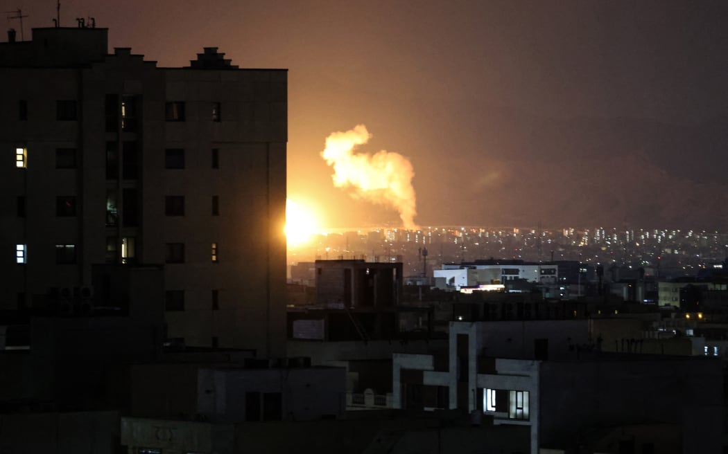 Smoke rises following airstrikes in a central area of the Iranian capital Tehran on March 6, 2026. Fresh strikes rocked Iran and Lebanon on March 6, as Israel vowed to escalate to a new phase in the Middle East war that has spiralled rapidly throughout the region and beyond. (Photo by ATTA KENARE / AFP)