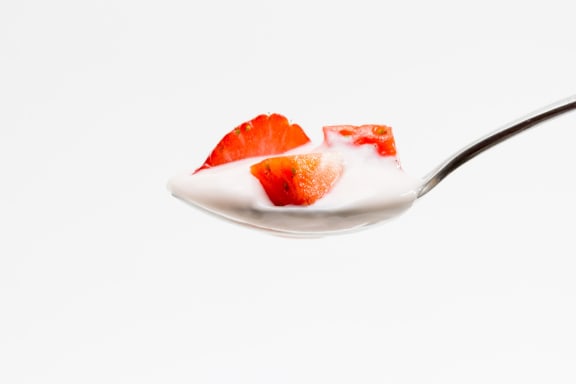 spoon of yoghurt and strawberries