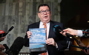 Finance Minister Grant Robertson with the Wellbeing Budget 2022