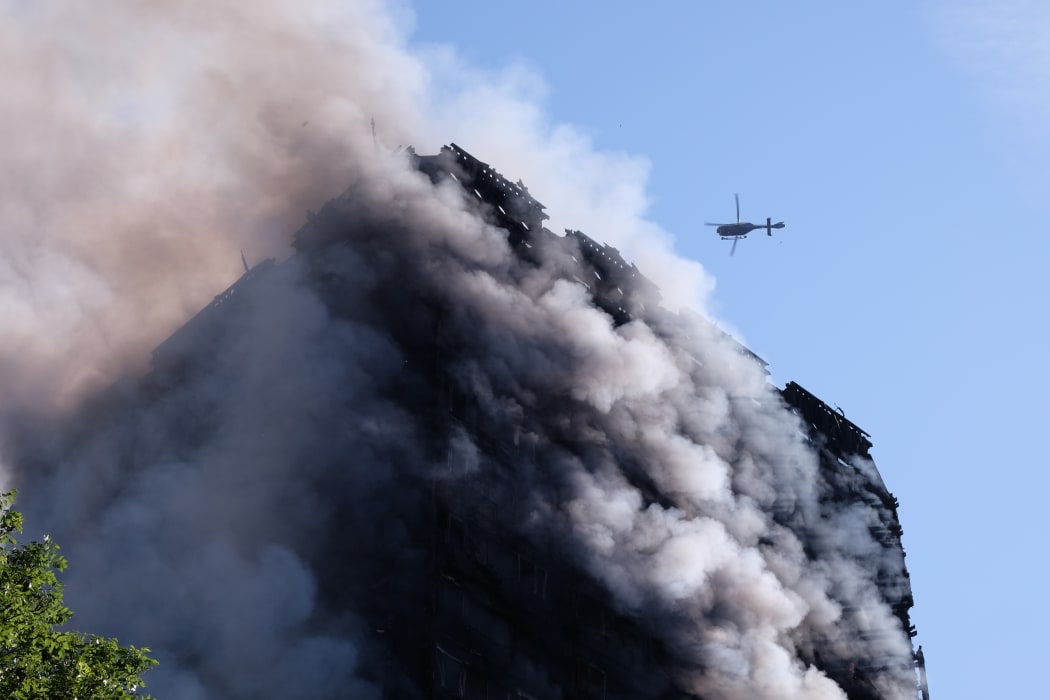 Flames and smoke engulf Grenfell Tower, a residential block of flats in west London on June 14, 2017. The fire caused 71 deaths.