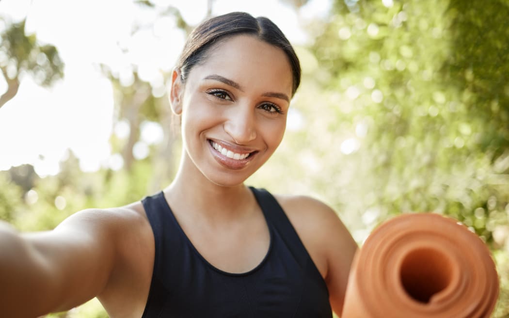 Cropped portrait of an attractive young female athlete taking selfies while exercising outdoors.