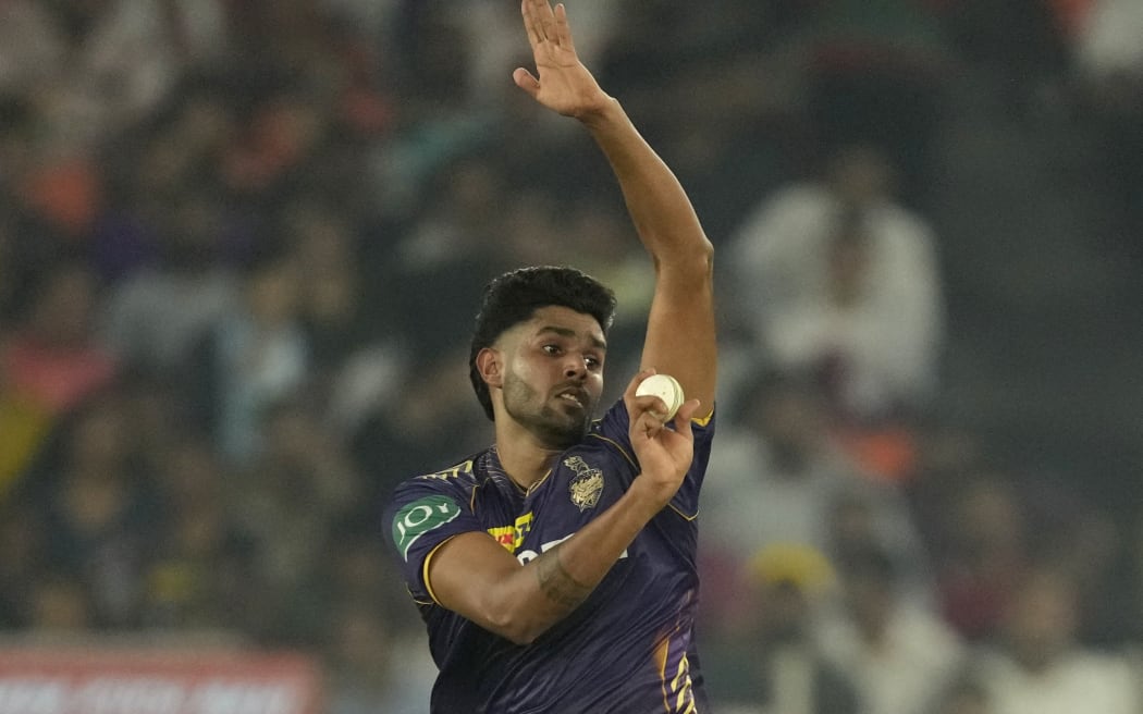 Kolkata Knight Riders' Harshit Rana bowls a delivery during the Indian Premier League qualifier cricket match between Kolkata Knight Riders and Sunrisers Hyderabad in Ahmedabad, India, Tuesday, May 21, 2024. (AP Photo/Ajit Solanki)