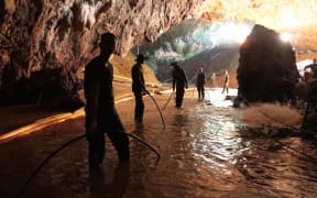 A Royal Thai Navy image on 7 July, 2018 shows Thai Navy soldiers in the flooded Tham Luang cave during rescue operations for the 12 boys and their football team coach trapped in the cave.