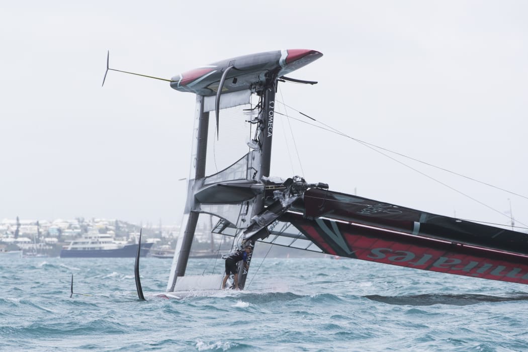 Team NZ's boat  capsizes at the start of the second race of the day.