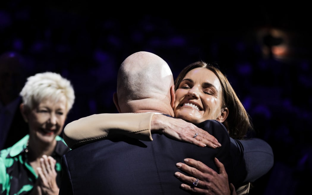 National Party leader Christopher Luxon at the party's launch of its 2023 election campaign.- - this is his wife hugging him.
