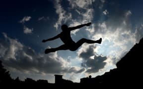 An athlete competes in a track and field event held by Russia's athletics federation for athletes banned from the Rio Olympics.