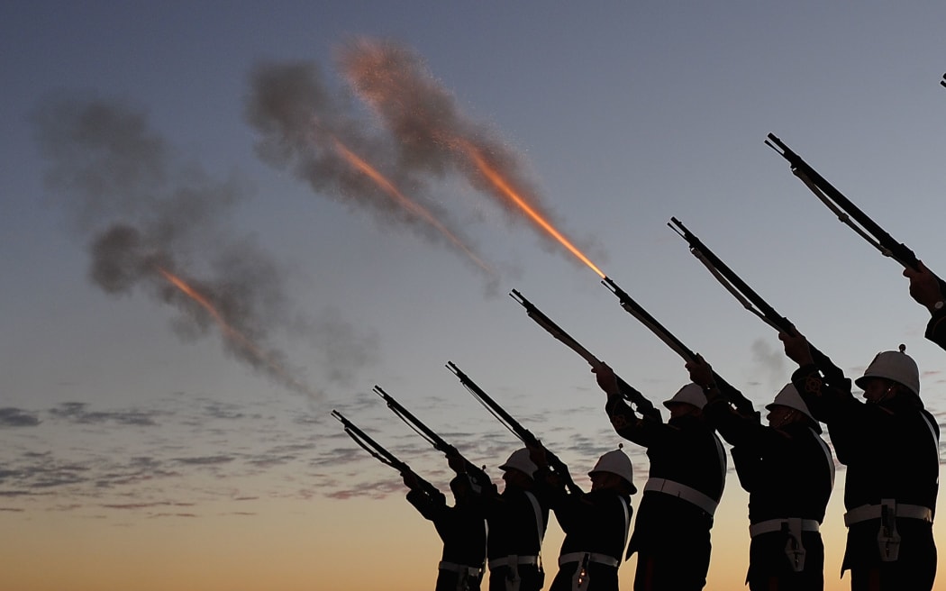 Members of the Albert Battery shoot a volley of fire during the Anzac Day dawn service at Currumbin Surf Life Saving Club on the Gold Coast on Saturday, April 25, 2015