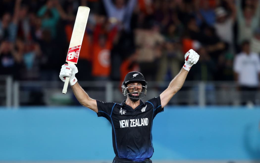 Grant Elliott raises his arms in triumph after hitting the winning six