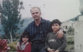 Hamid with two of his children.