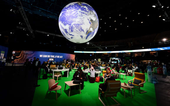 Delegates attend the third day of the COP26 UN Climate Summit in Glasgow, 3 November 2021.