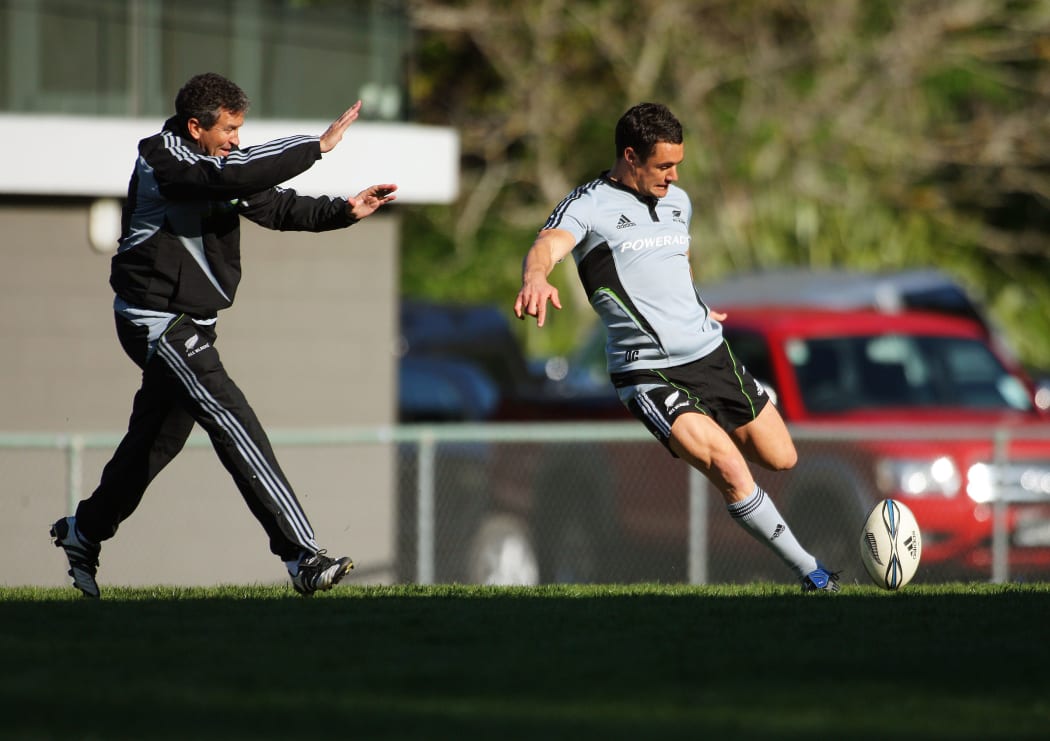 Dan Carter practices dropkicking for goal under pressure from backs coach Wayne Smith in 2009. All Blacks Training Session at Rugby League Park, Newtown, Wellington.